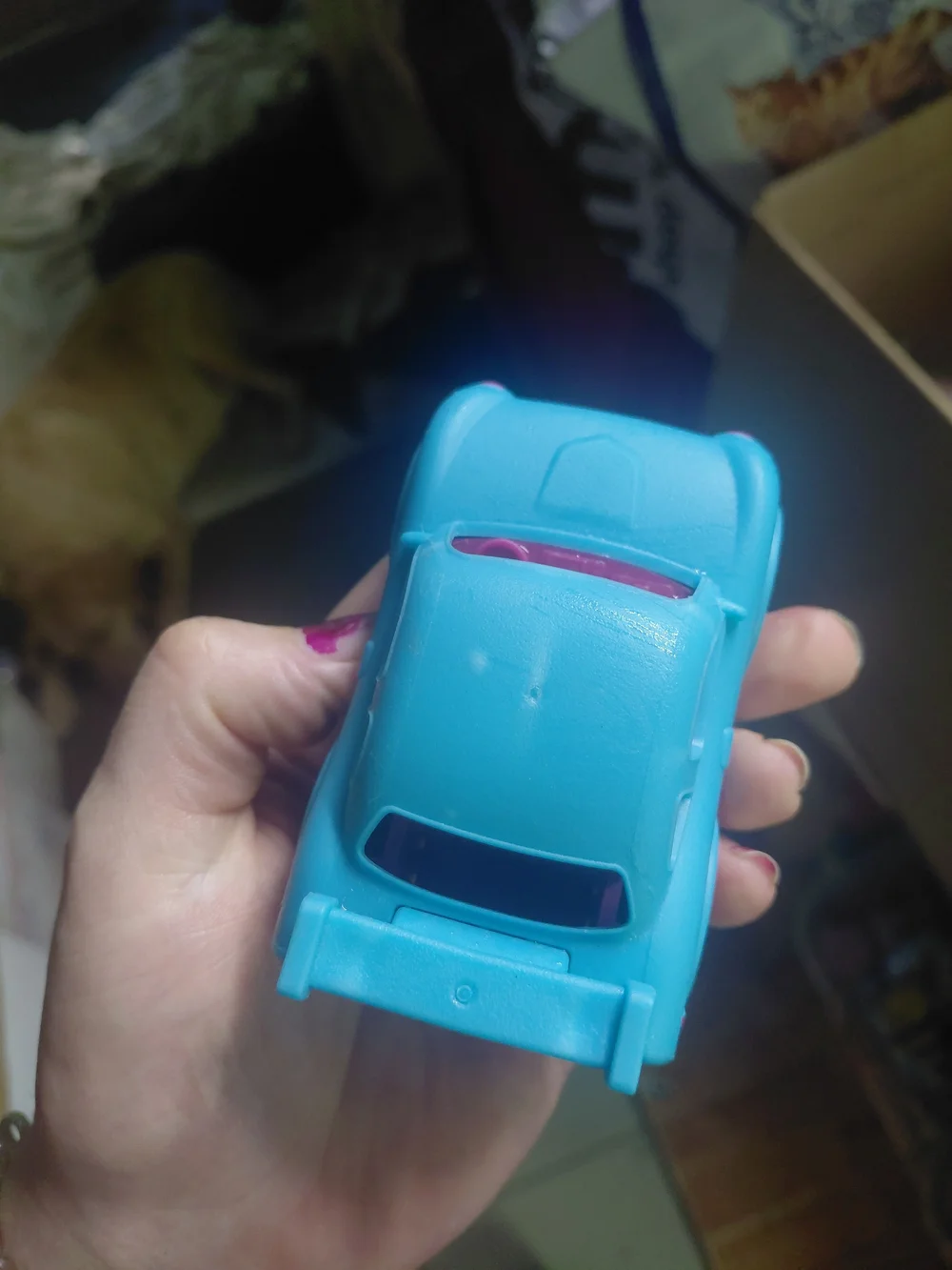B. toys Happy Cruisers mini race car featuring a vibrant blue body with contrast